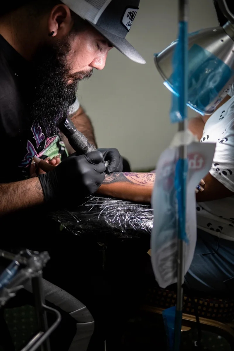 a man with a beard holding a person's leg